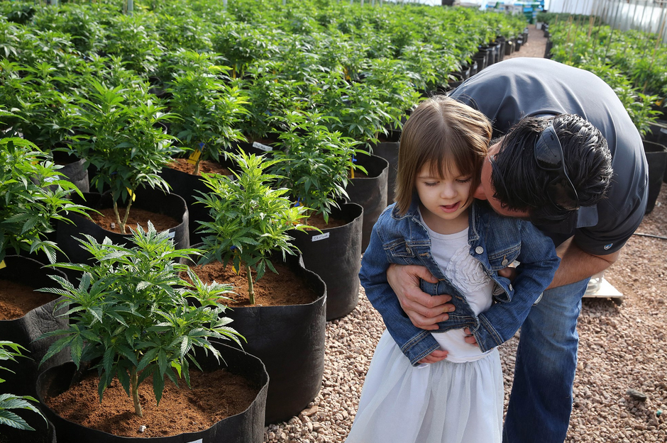 Matt Figi hugs his once severely-ill 7-year-old daughter Charlotte 20200409092534.png